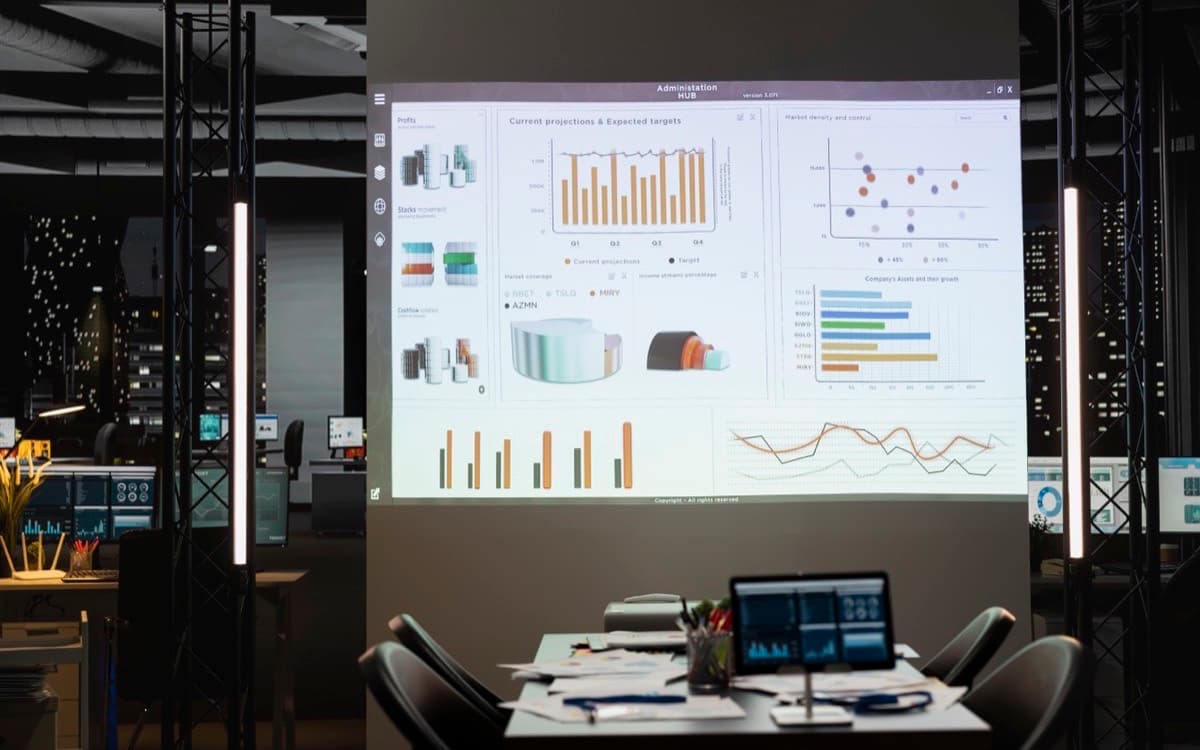 Analytics dashboards projected in a darkened office